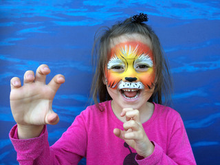 Wall Mural - Little child with lion face painting