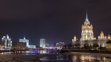 Wall Mural - Hotel Ukraine winter night timelapse. Seen as reflected in the Moscow River