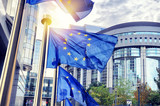 Fototapeta  - EU flags waving in front of European Parliament building in Brus