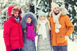© Syda Productions - group of smiling men and women in winter forest