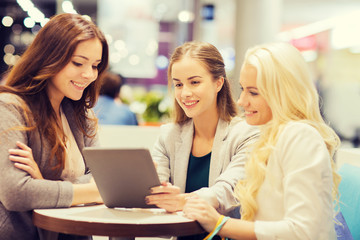 Canvas Print - happy young women with tablet pc and shopping bags