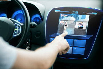 Poster - male hand pointing finger to monitor on car panel