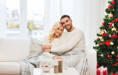 Canvas Print - happy couple at home with christmas tree