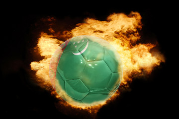 football ball with the flag of turkmenistan on fire