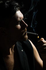 Poster - Bearded man lights up cigarette