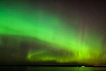 Wall Mural - northern lights over lake in finland