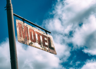 Motel Vintage Rusted Sign. Old rusted sign hanging off the side of an old country road. Motel sign.