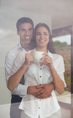 Wall Mural - relaxet young couple drink first morning coffee