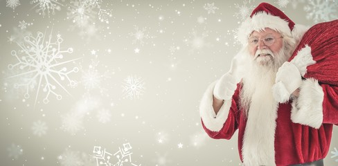 Wall Mural - Composite image of santa likes to carry his sack