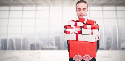 Poster - Composite image of concentrated businessman holding gift