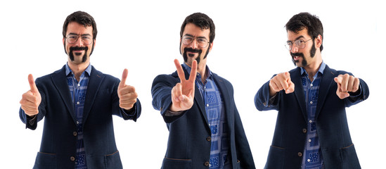 Wall Mural - Vintage young man doing victory gesture