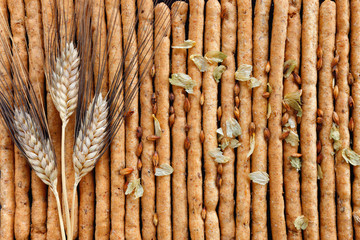 Barley bread sticks with toasted seeds and dry hop flowers