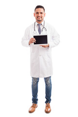 Wall Mural - Doctor showing screen of a tablet