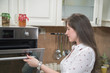 © FotoCuisinette - Young woman baking at home.
