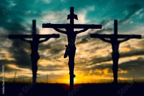 Obraz na płótnie canvas czteroczęściowy "tetraptyk" Sylwetka Jezusa z krzyżem na zachód koncepcja dla religii,