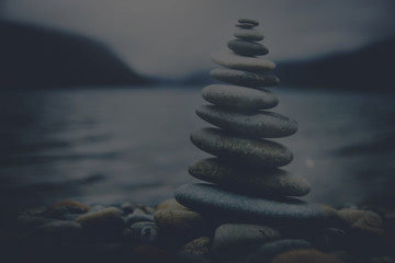 Wall Mural - Zen Balancing Pebbles Misty Lake Stone Stack Tranquil Concept