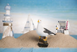 Fototapeta Tęcza - Holiday by the sea, gull, lantern, ship
