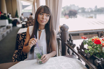 girl drinks mojito