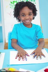 Wall Mural - Happy kid enjoying arts and crafts painting