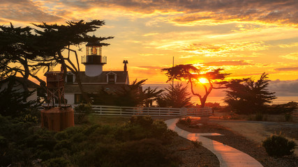 Wall Mural - View of Point Pinos lighthouse on the Monterey coast at sunset