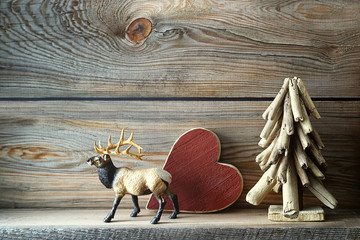 Christmas tree decorations on wooden shelf