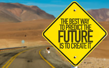 The Best Way To Predict The Future Is To Create It sign on desert road
