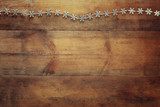 Fototapeta Dziecięca - image of christmas festive decoration on wooden background. retro filtered