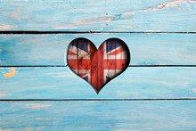 Love United Kingdom. Heart And Flag On A Blue Wooden Board