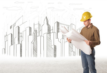 Engineer man with building city drawing in background