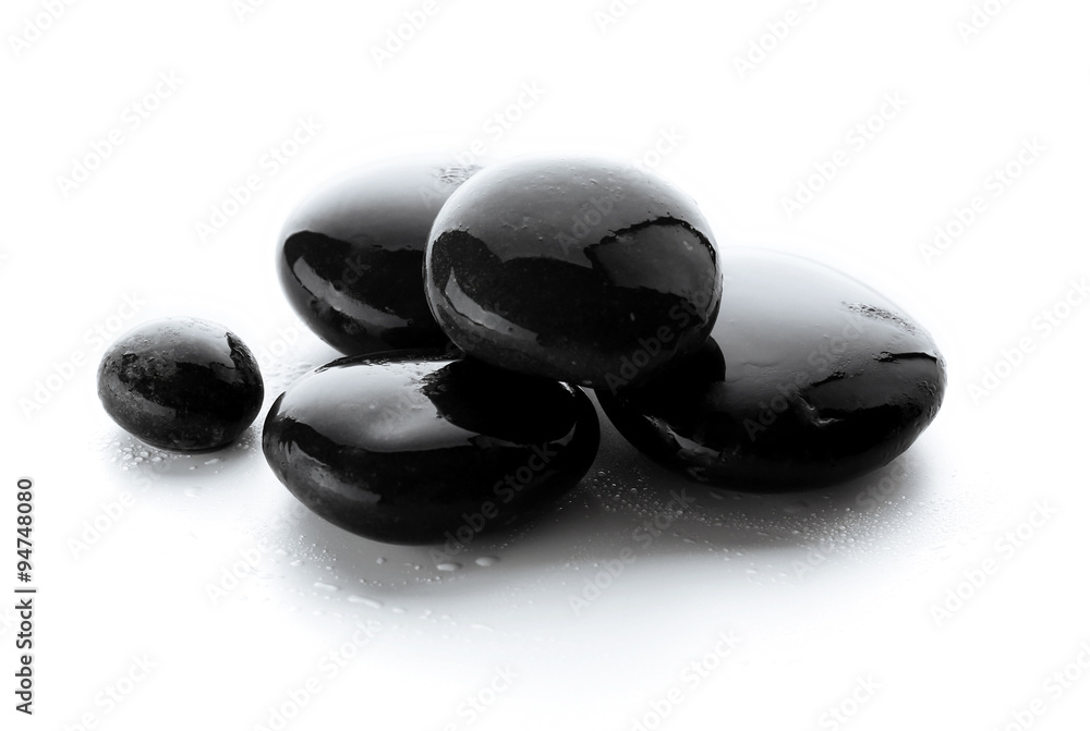 Wet spa stones isolated on white