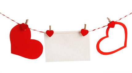 Wall Mural - Paper hearts and empty sheet hang on cord isolated on white background