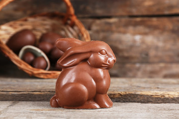 Easter chocolate bunny and eggs on wooden background