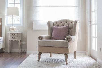 Poster - classic chair on carpet with pillow