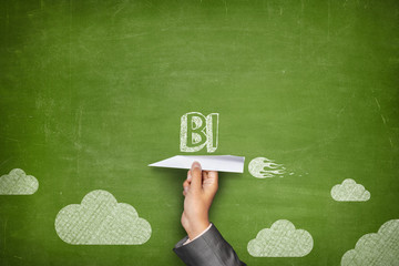 BI concept on blackboard with paper plane