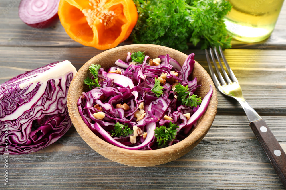 Red cabbage salad served in bowl closeup