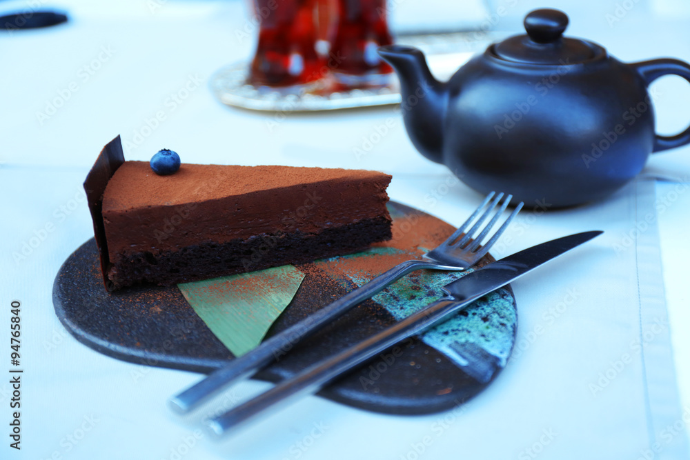 Cup of tea and cake on a table in cafe
