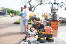 Buddhist Elephant On A Background Of The Newlyweds. Selective Focus