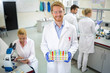 © luckybusiness - Chemical technician hold colorful test tubes