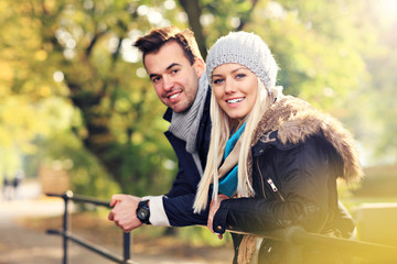 Wall Mural - Young romantic couple in the park in autumn