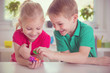 © spass - Two happy children playing with dices