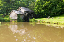 Historic Edwin B. Mabry Grist Mill (Mabry Mill) In Rural Virginia On Blue Ridge Parkway And Reflection On Pond In Summer