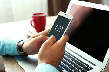 Poster - Man using mobile phone in office