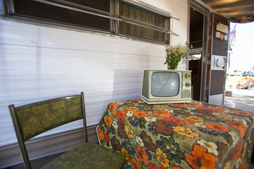 Exterior view of old TV and trailer at Vintage Trailers and Campers, the 4th Annual Vintage Trailer Bash, Flying Flag RV Resort, Buellton, California.