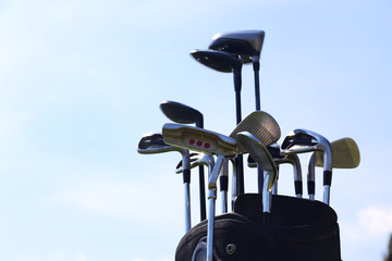 Sticker - Golf bag with clubs on blue sky background