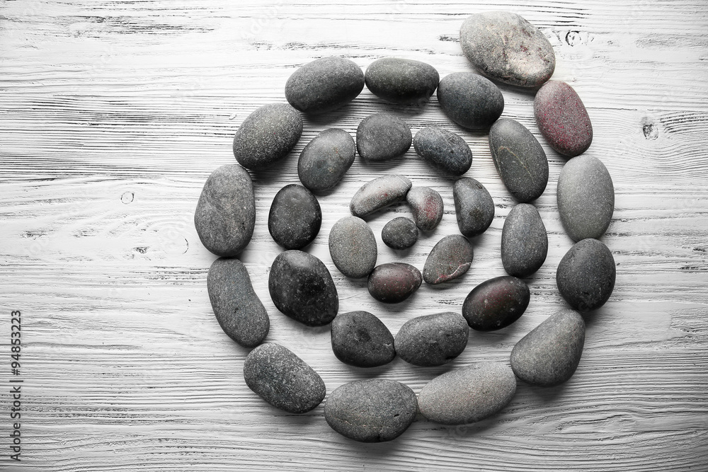 Spa stones on wooden background