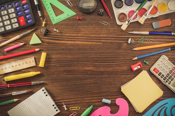 school supplies on wood