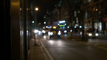 Buses, Cars, Bikes, Taxi With Headlights On Running In The Night Through The Streets Of London.