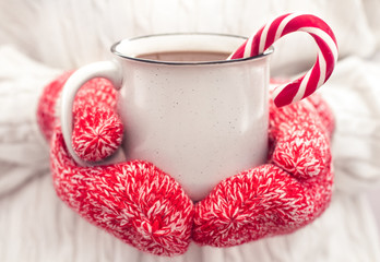 Hot chocolate in the hands.