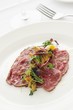 © neillangan - beef carpaccio plated appetizer starter