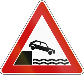 Wall Mural - A road warning sign in Germany: Quayside or river bank